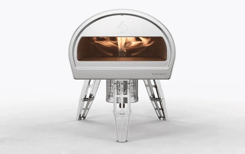 Gozney pizza oven with a lit fire